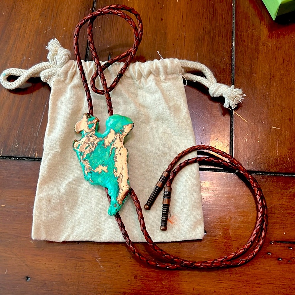 Bolo tie made with turquoise rock, wrapped in copper, leather customized